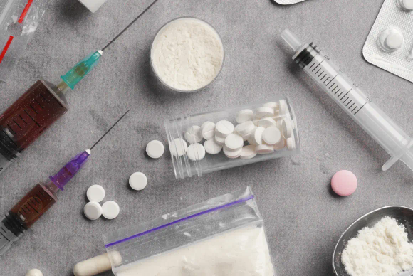 What Is the Difference Between "Production of a Controlled Drug" and "Being Concerned in the Production of a Controlled Drug"?